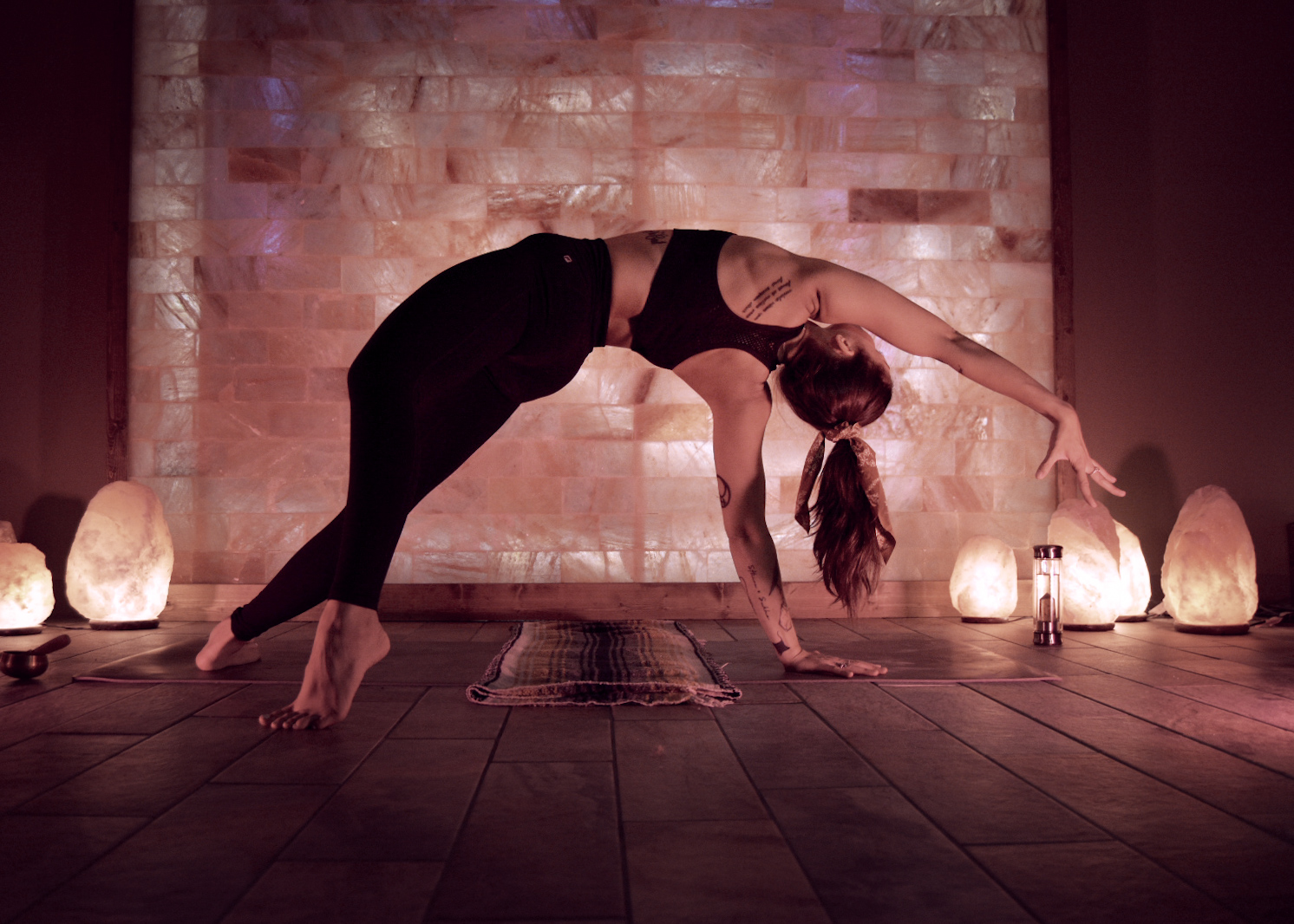 Dramatic yoga backbend pose in the Sweet Dreams salt therapy room